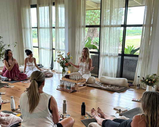 Tara gracefully serves tea during a serene ceremony at a women's retreat in Byron Bay